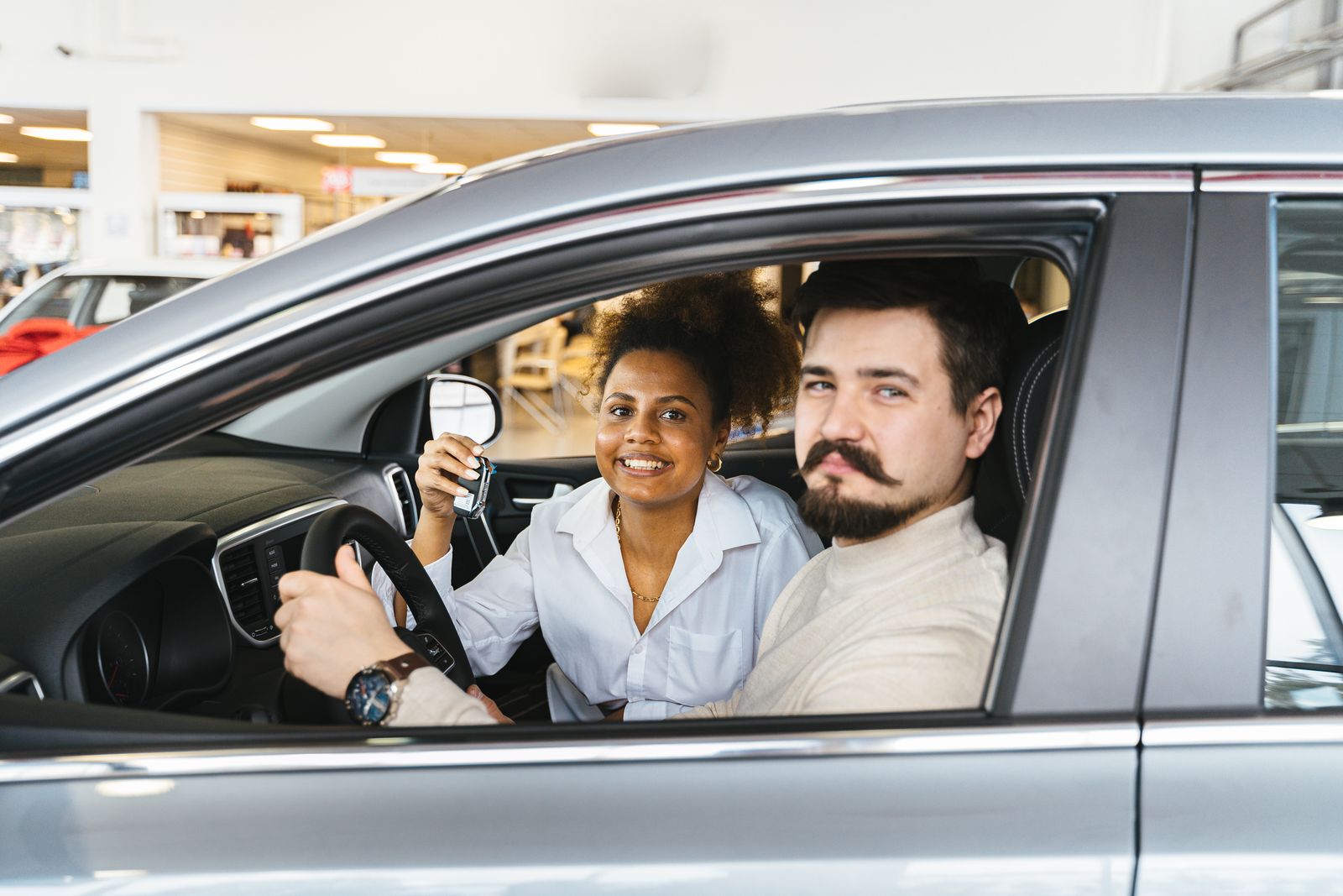 A member handing over the keys of their old car